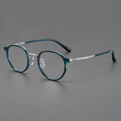 Round eyeglasses in acetate and titanium with widened outer corners and slender metal temples in Peacock Blue / Silver, three quarter view additional product view