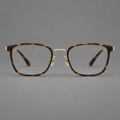 Rounded rectangular eyeglasses in acetate and titanium with bold corners and engraved metal temples in Tortoiseshell / Gold, front view side view