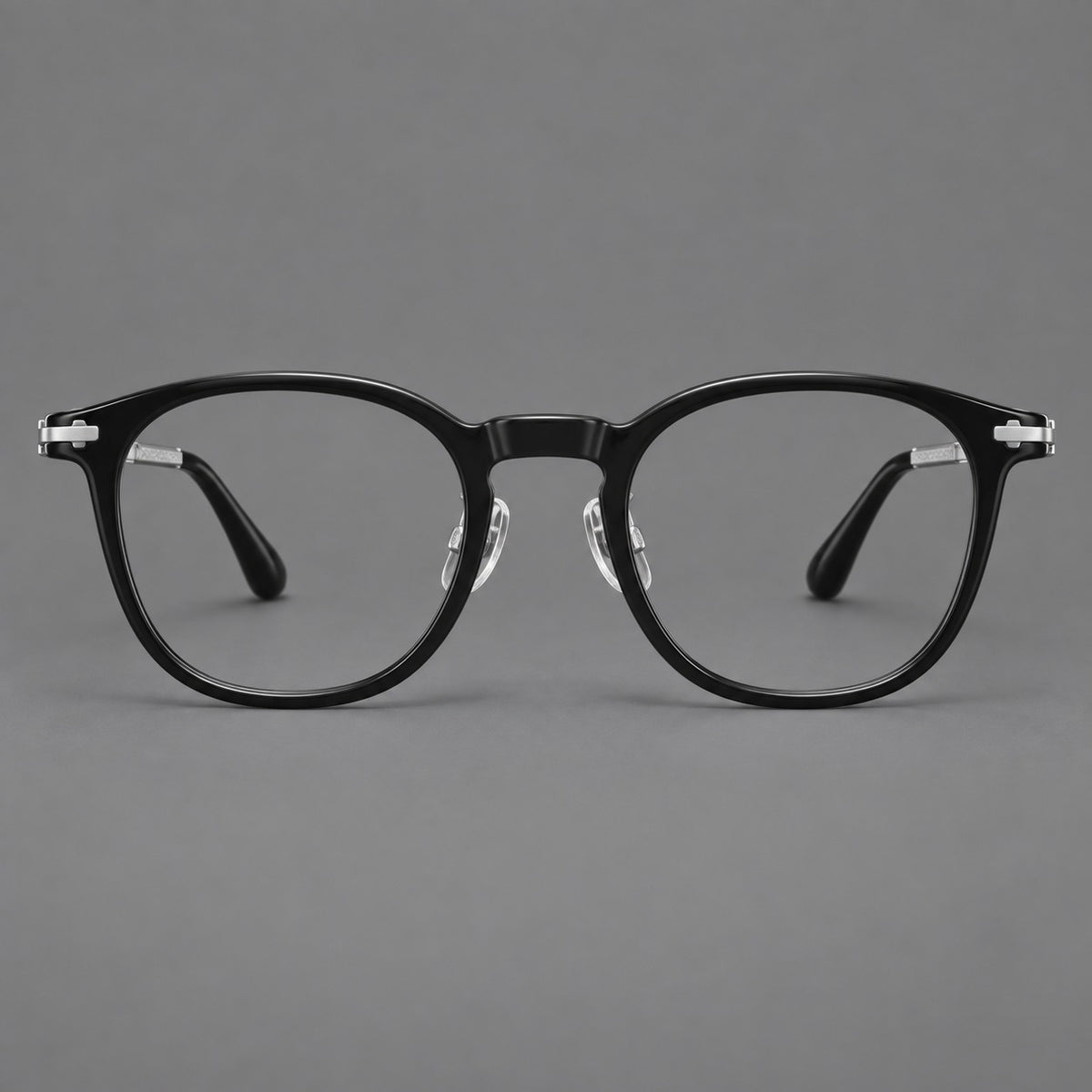 Retro acetate and titanium eyeglasses with soft square rims and sculpted metal corners in Black / Silver, front view