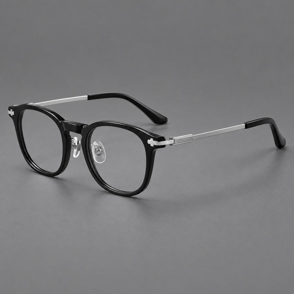 Retro acetate and titanium eyeglasses with soft square rims and sculpted metal corners in Black / Silver, three quarter view