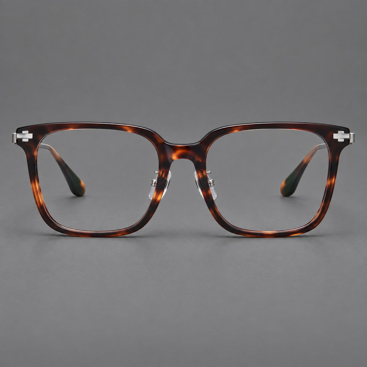 Classic acetate and titanium eyeglasses with broad square rims and textured metal temples in Tortoiseshell / Grey, front view