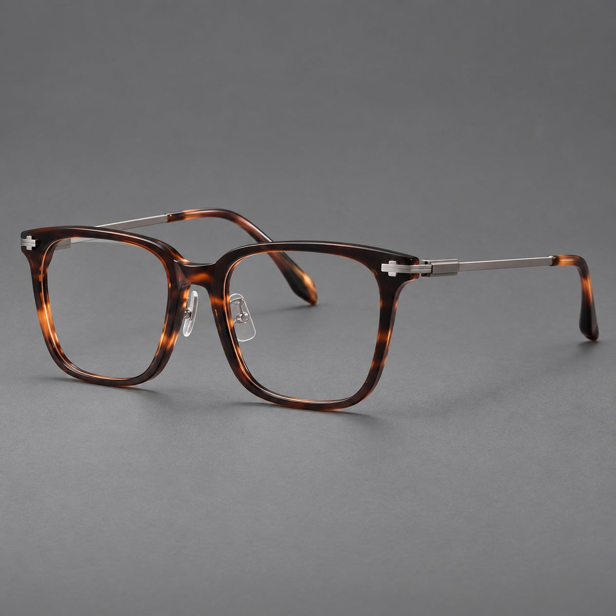 Classic acetate and titanium eyeglasses with broad square rims and textured metal temples in Tortoiseshell / Grey, three quarter view