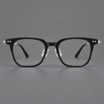 Classic acetate and titanium eyeglasses with squared brows and paired corner rivets in Black / Silver, front view frame detail