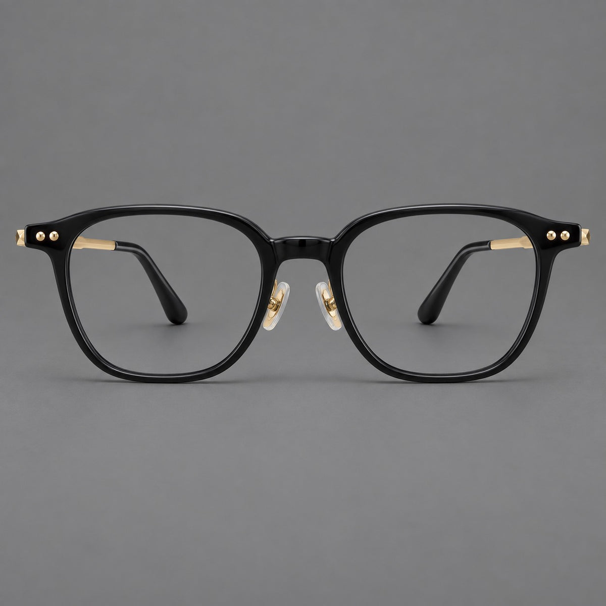 Vintage acetate and titanium eyeglasses with rounded square rims and slotted metal temples in Black / Gold, front view