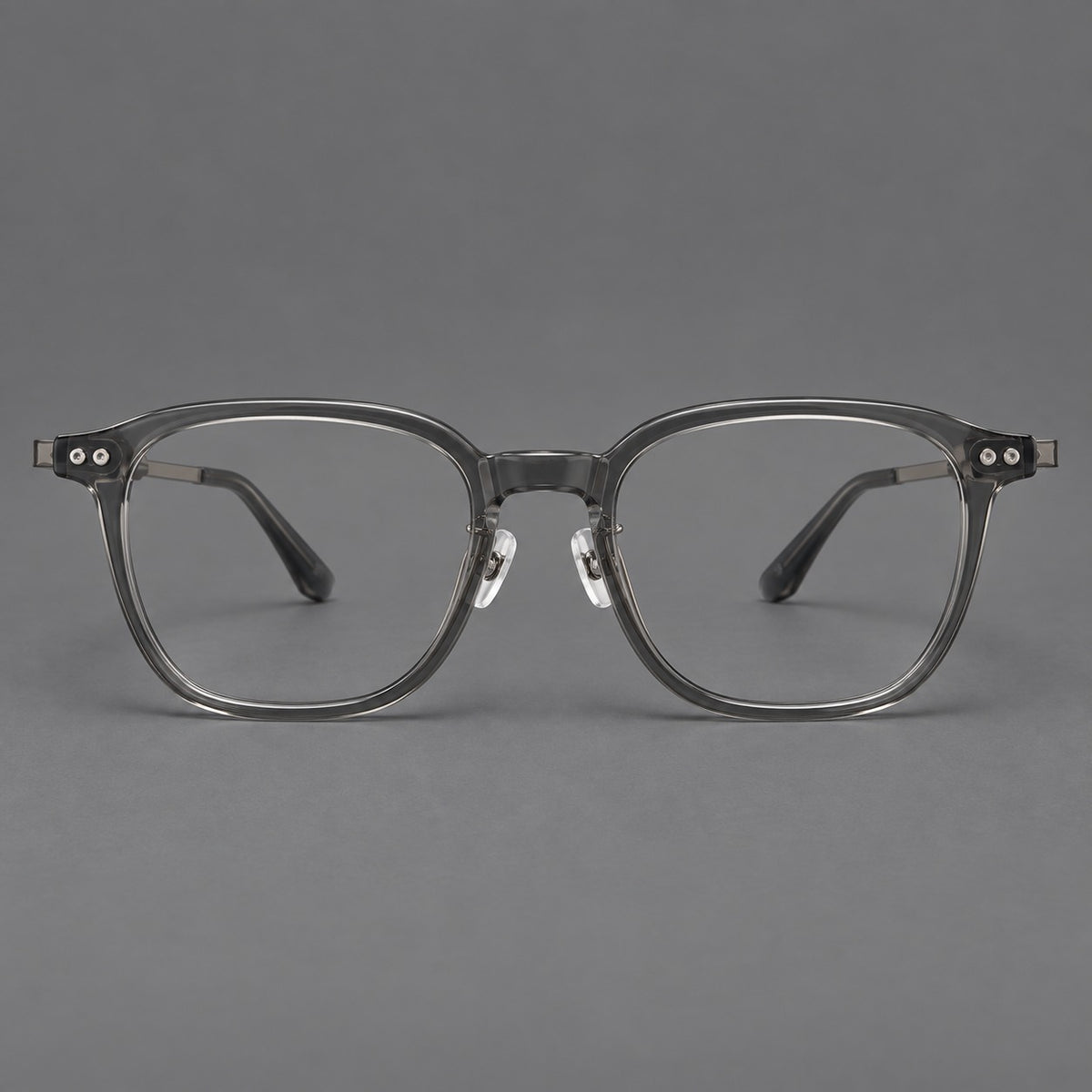Vintage acetate and titanium eyeglasses with rounded square rims and slotted metal temples in Clear Grey, front view