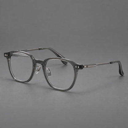 Vintage acetate and titanium eyeglasses with rounded square rims and slotted metal temples in Clear Grey, three quarter view front view