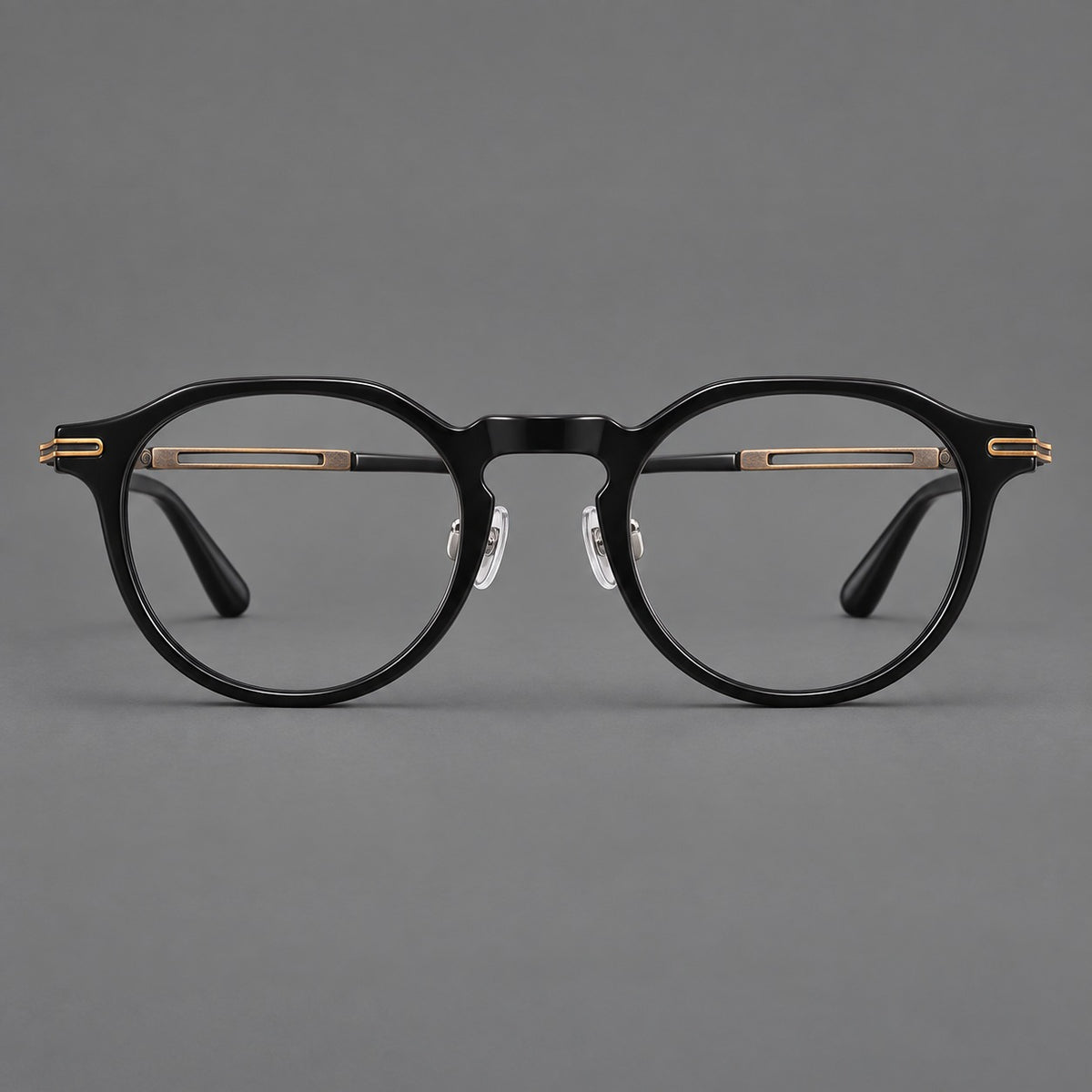 Retro acetate and titanium eyeglasses with round rims and distinctive looped metal joints in Black / Antique Bronze, front view