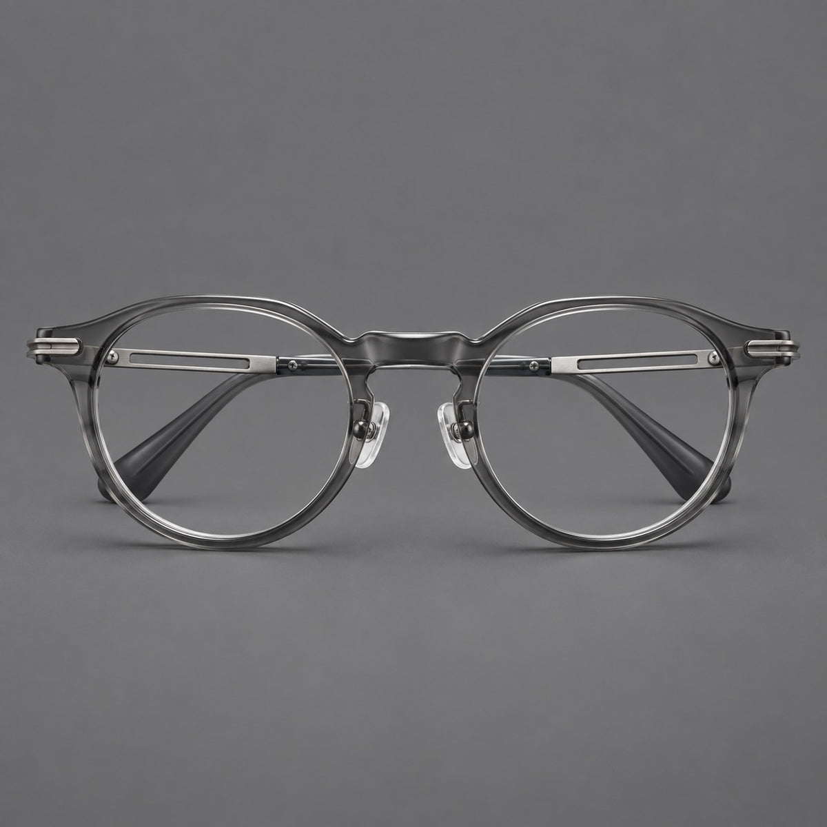 Retro acetate and titanium eyeglasses with round rims and distinctive looped metal joints in Clear Grey / Brushed Grey, front view