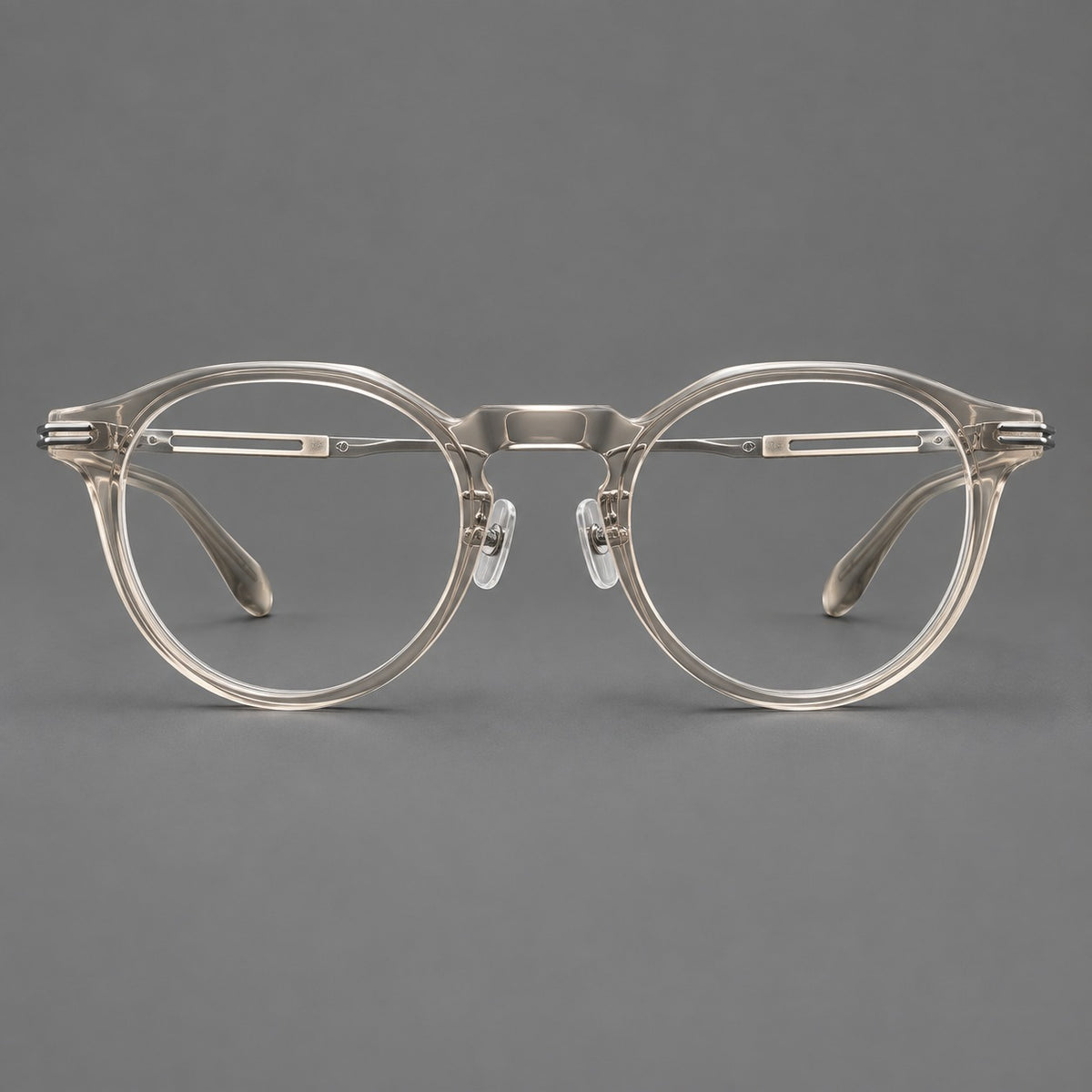 Retro acetate and titanium eyeglasses with round rims and distinctive looped metal joints in Clear Cool Tea / Silver, front view
