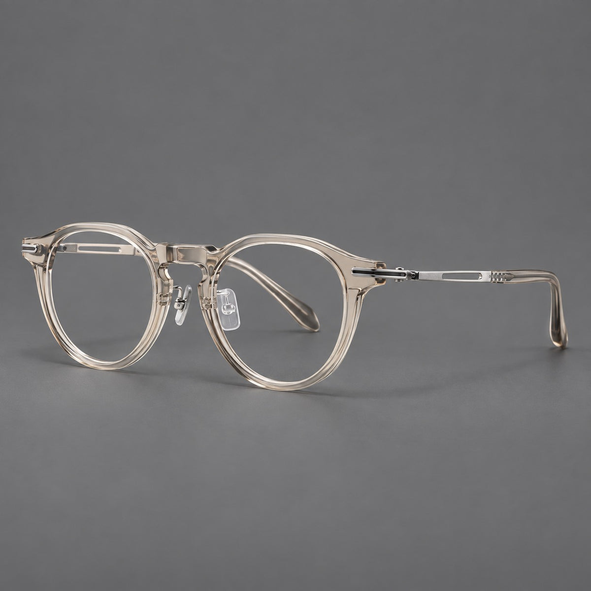 Retro acetate and titanium eyeglasses with round rims and distinctive looped metal joints in Clear Cool Tea / Silver, three quarter view
