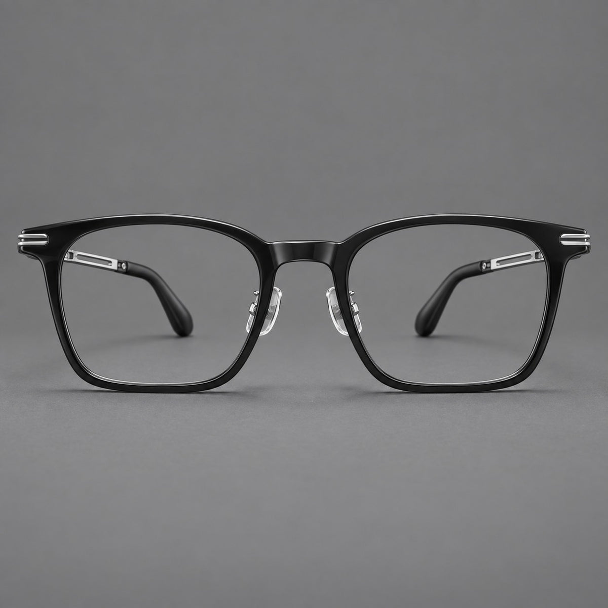 Acetate and titanium eyeglasses with rounded rectangular rims and sculpted open loop joints in Black / Silver, front view