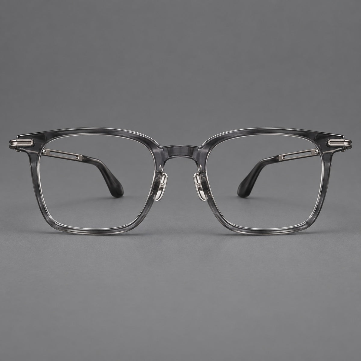 Acetate and titanium eyeglasses with rounded rectangular rims and sculpted open loop joints in Clear Grey / Brushed Grey, front view