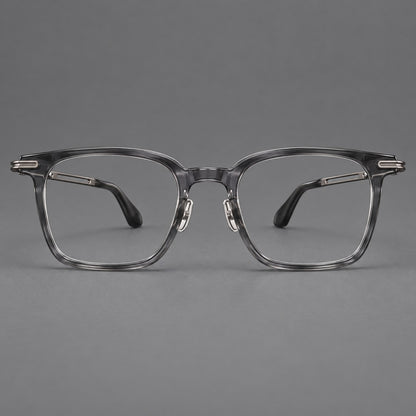 Acetate and titanium eyeglasses with rounded rectangular rims and sculpted open loop joints in Clear Grey / Brushed Grey, front view temple detail