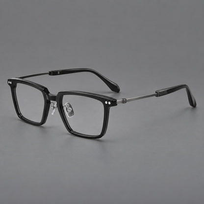Classic acetate and titanium eyeglasses with a straight brow and rounded rectangular rims in Black / Brushed Grey, three quarter view lens detail