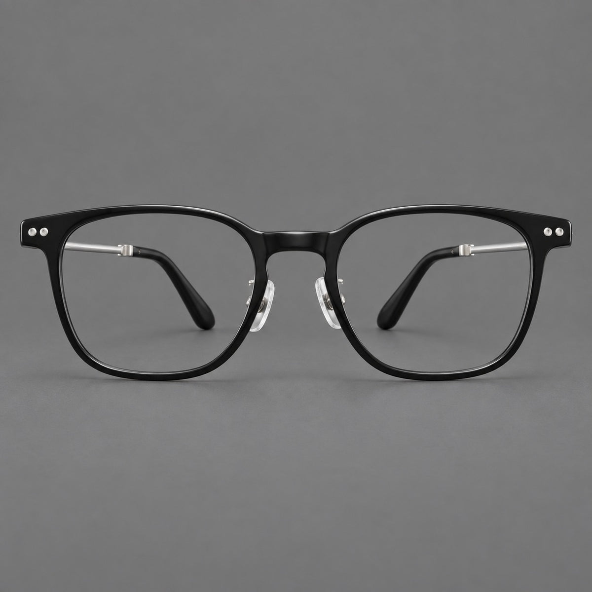 Vintage acetate and titanium eyeglasses with soft square rims and paired metal rivets in Black / Silver, front view