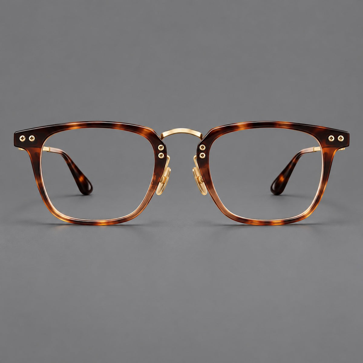 Acetate and titanium eyeglasses with soft square rims and an arched metal bridge in Tortoiseshell / Gold, front view