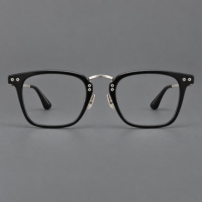 Acetate and titanium eyeglasses with soft square rims and an arched metal bridge in Black / Silver, front view temple detail