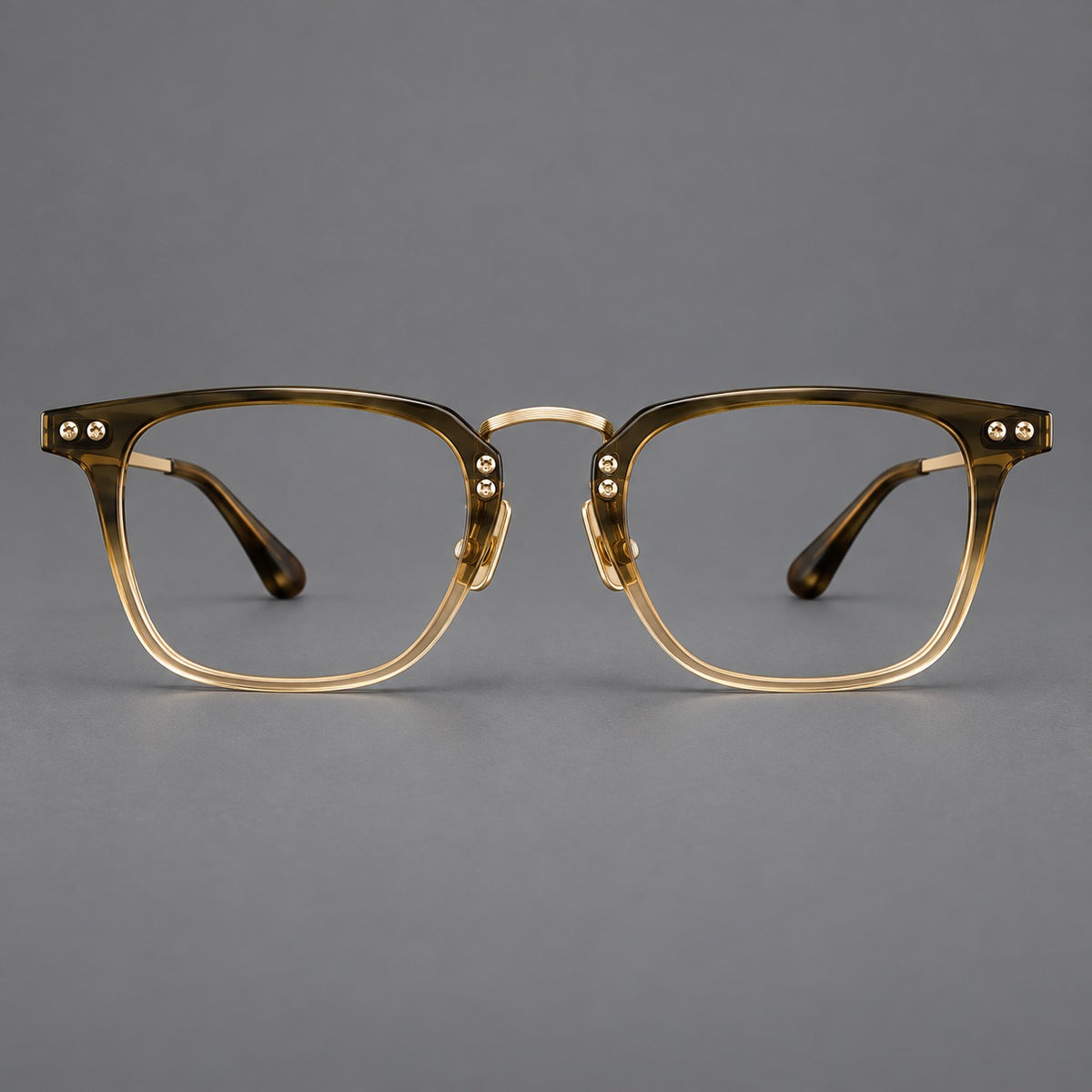 Acetate and titanium eyeglasses with soft square rims and an arched metal bridge in Tea Gradient / Gold, front view