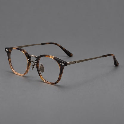 Retro acetate and titanium eyeglasses with softly rounded rims and a metal bridge in Tortoiseshell / Gunmetal, three quarter view