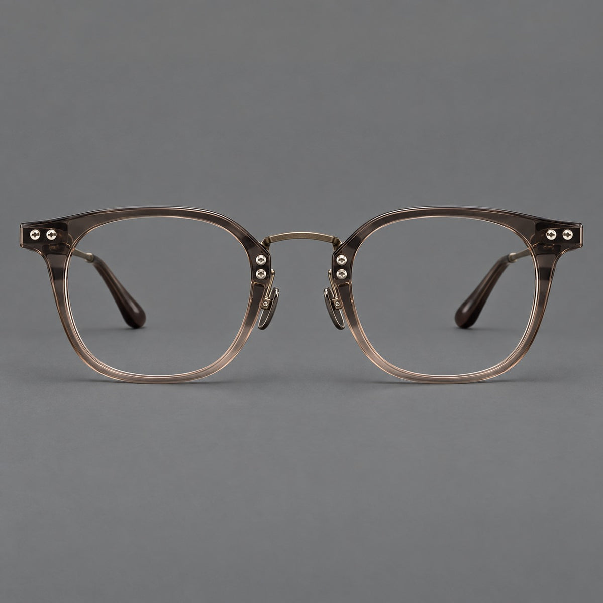 Retro acetate and titanium eyeglasses with softly rounded rims and a metal bridge in Coffee Brown, front view