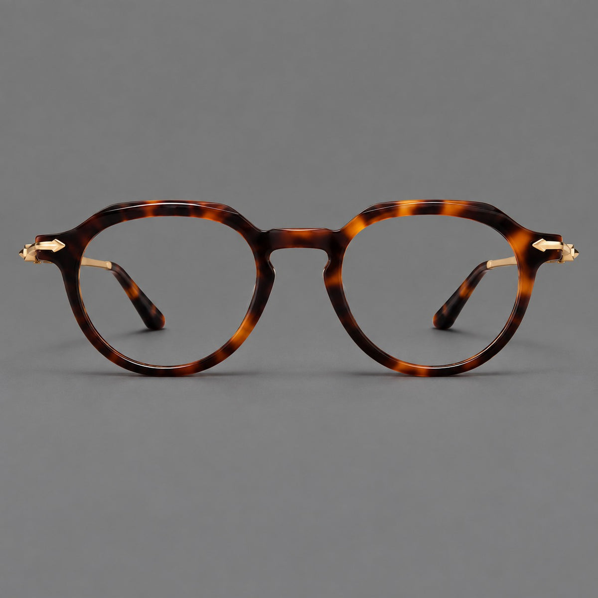 Retro acetate and titanium eyeglasses with panto rims and decorative arrow corner accents in Tortoiseshell / Gold, front view