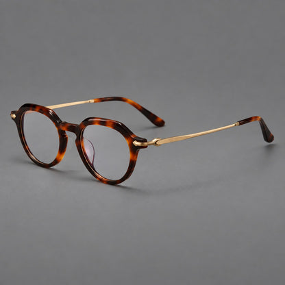 Retro acetate and titanium eyeglasses with panto rims and decorative arrow corner accents in Tortoiseshell / Gold, three quarter view