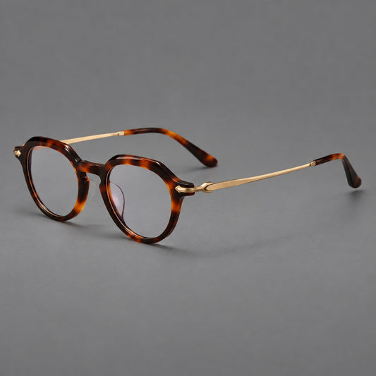 Retro acetate and titanium eyeglasses with panto rims and decorative arrow corner accents in Tortoiseshell / Gold, three quarter view