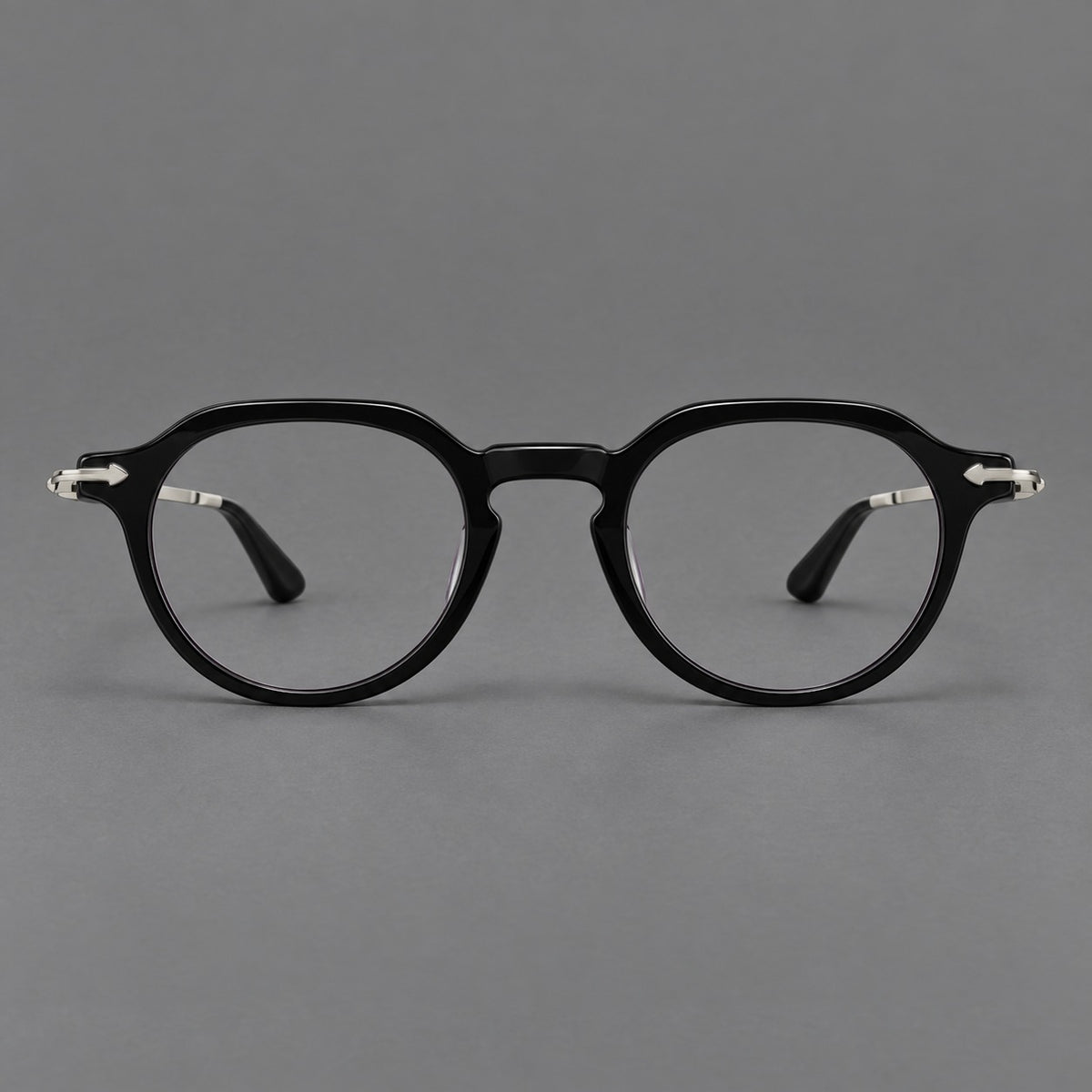 Retro acetate and titanium eyeglasses with panto rims and decorative arrow corner accents in Black / Silver, front view