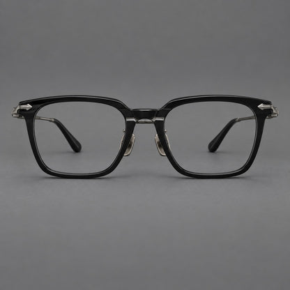 Bold acetate and titanium eyeglasses with rectangular rims and sculpted arrow accents in Black / Gunmetal, front view temple detail