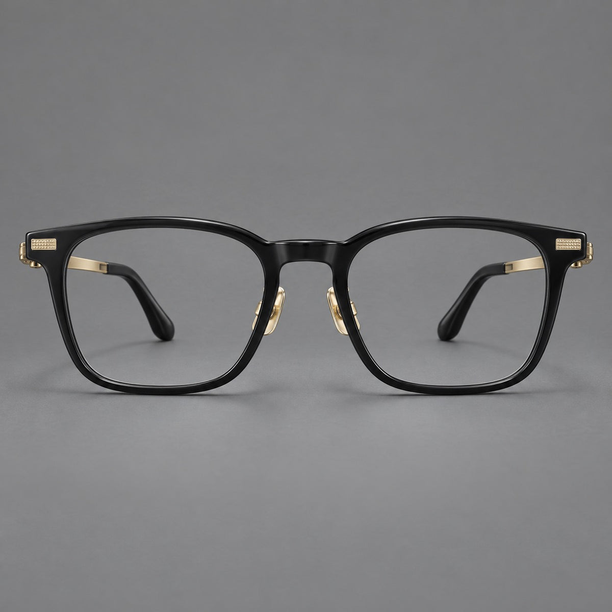 Classic acetate and titanium eyeglasses with rounded square rims and textured corner accents in Black / Gold, front view