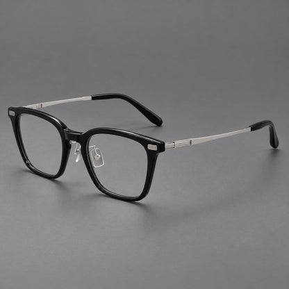 Classic acetate and titanium eyeglasses with rounded square rims and textured corner accents in Black / Silver, three quarter view additional product view