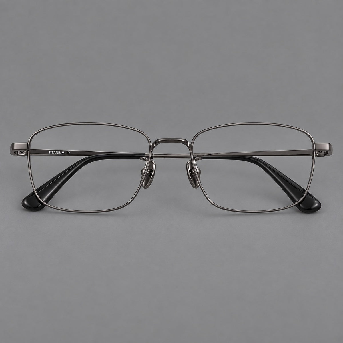 Modern square titanium glasses with an angular bridge and broad straight temples in Gunmetal, front view
