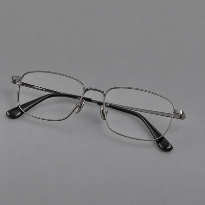 Modern square titanium glasses with an angular bridge and broad straight temples in Gunmetal, three quarter view front view