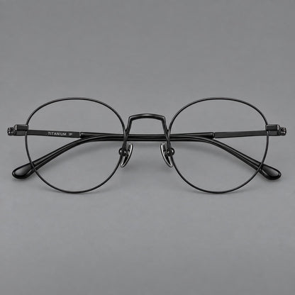 Retro round titanium glasses with a raised bridge and smooth corner shoulders in Black, front view side view