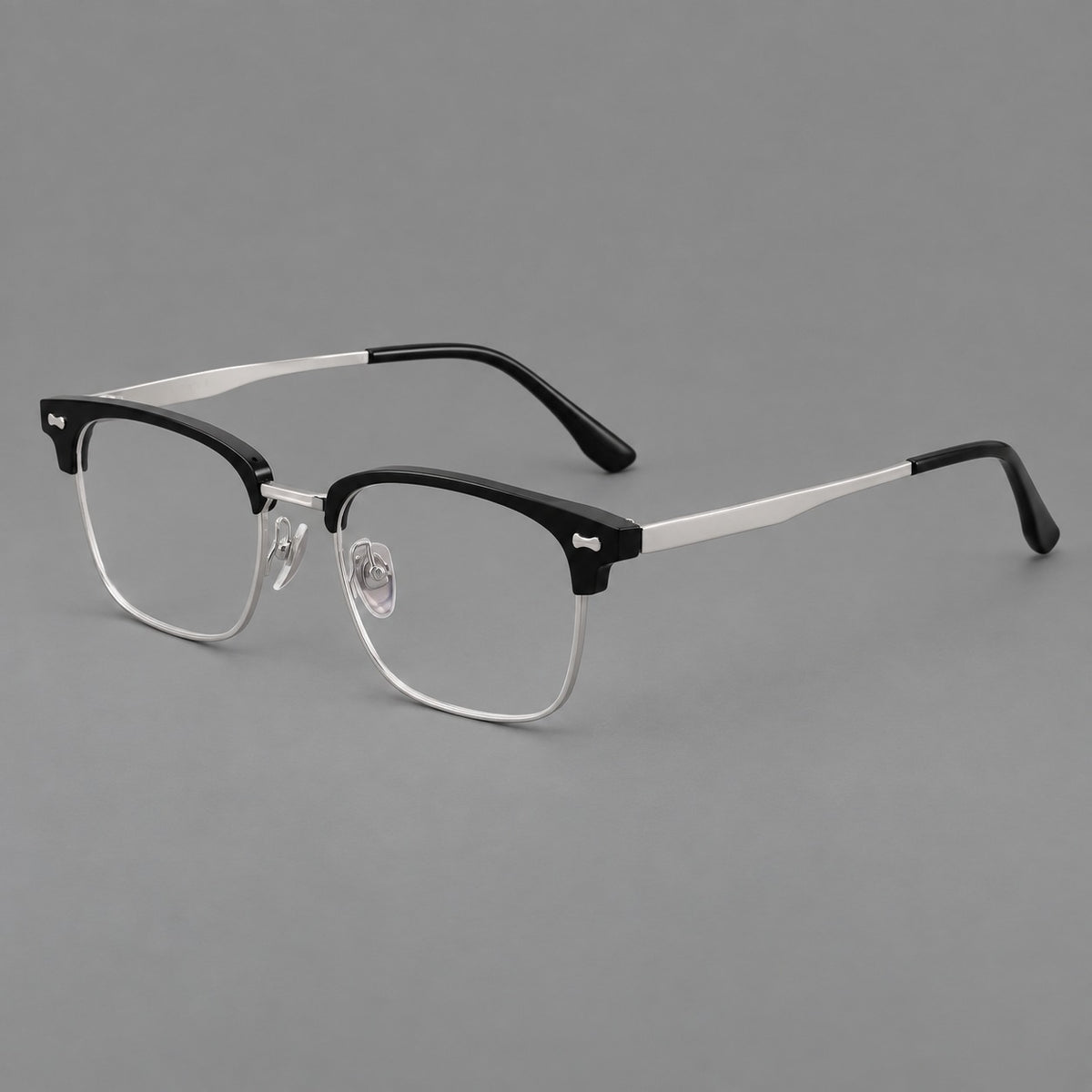 Classic browline titanium glasses with fine lower rims and subtle corner accents in Black and Silver, three quarter view