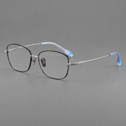 Soft square titanium glasses with angled upper corners and decorated hinges in Black and Silver, three quarter view front view