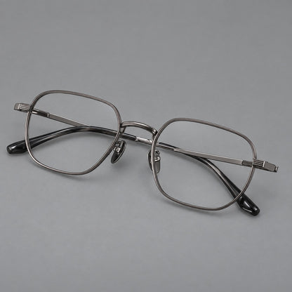Retro square titanium glasses with rounded rims and finely grooved shoulders in Gunmetal, three quarter view