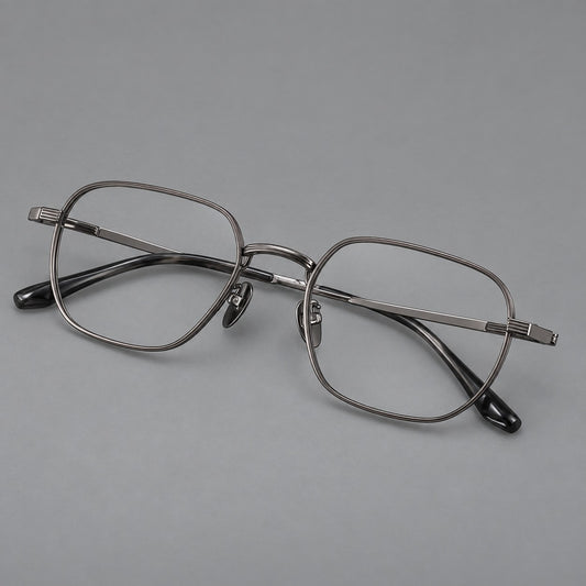 Retro square titanium glasses with rounded rims and finely grooved shoulders in Gunmetal, three quarter view