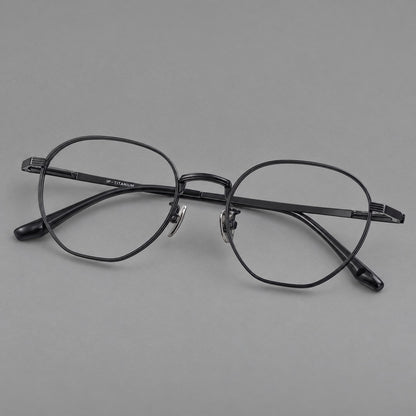 Retro panto titanium glasses with a curved bridge and fine parallel rim grooves in Black, three quarter view