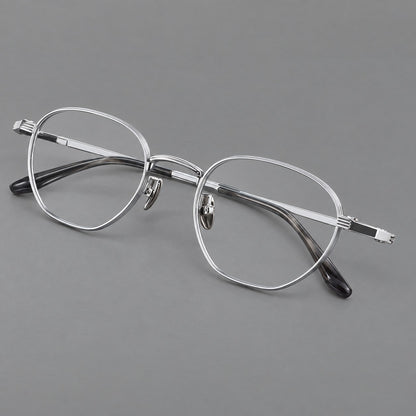 Retro panto titanium glasses with a curved bridge and fine parallel rim grooves in Black and Silver, three quarter view front view