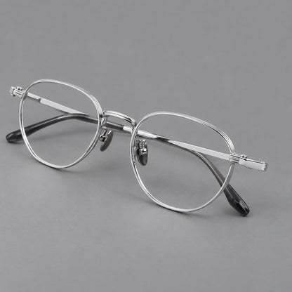 Retro panto titanium glasses with a curved bridge and fine parallel rim grooves in Silver, three quarter view lens detail