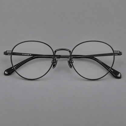 Rounded panto titanium glasses with a raised bridge and dotted temple accents in Black, front view side view