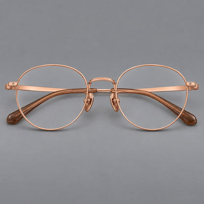 Rounded panto titanium glasses with a raised bridge and dotted temple accents in Rose Gold, front view additional product view