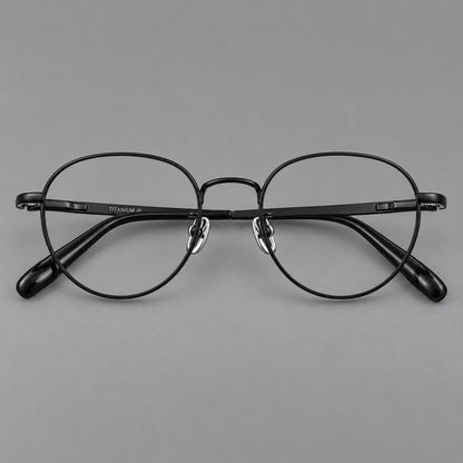 Classic round titanium glasses with broad flat temples and inset hinge details in Black, front view side view