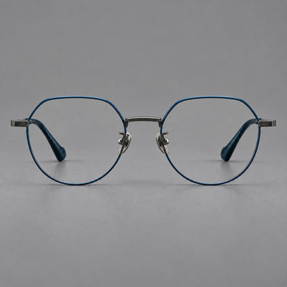 Geometric titanium glasses with soft polygonal rims and fine shoulder detailing in Blue and Gunmetal, front view frame detail