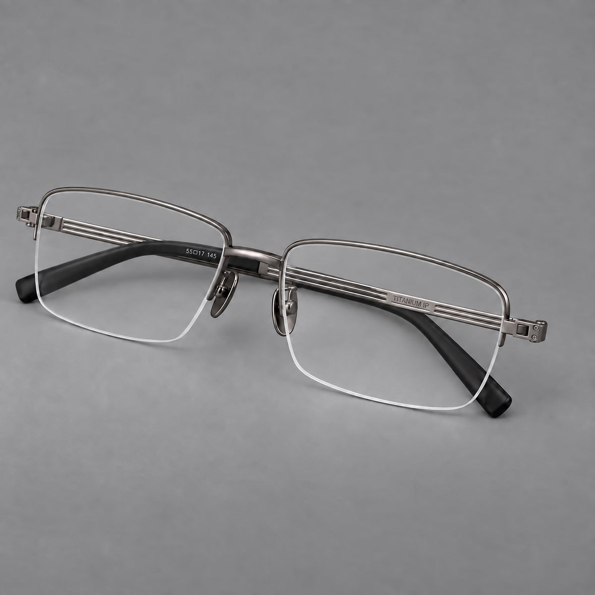 Classic half frame titanium glasses with rectangular lenses and lined temples in Gunmetal, three quarter view