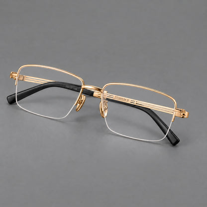 Classic half frame titanium glasses with rectangular lenses and lined temples in Gold, three quarter view lens detail