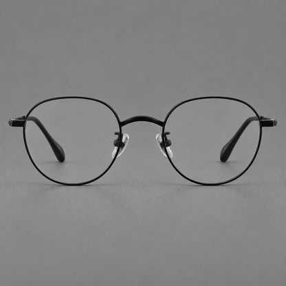 Compact round titanium glasses with an arched bridge and textured temple accents in Black, front view side view