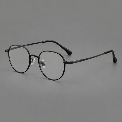 Compact round titanium glasses with an arched bridge and textured temple accents in Black, three quarter view