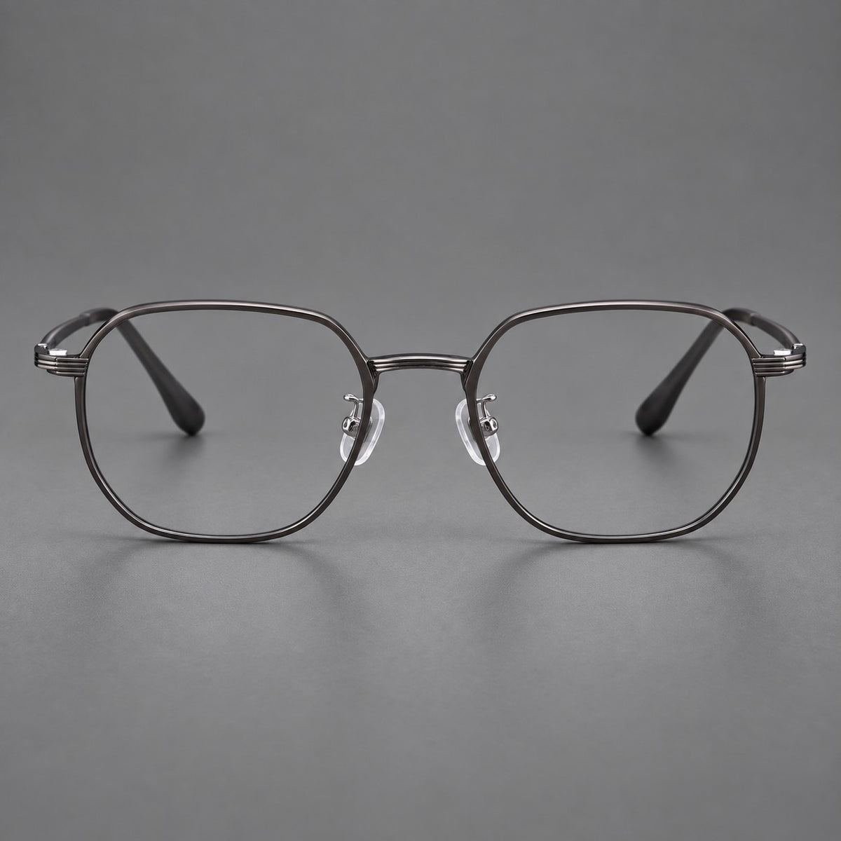 Geometric titanium glasses with flattened corners and a finely ridged bridge in Dark Grey, front view